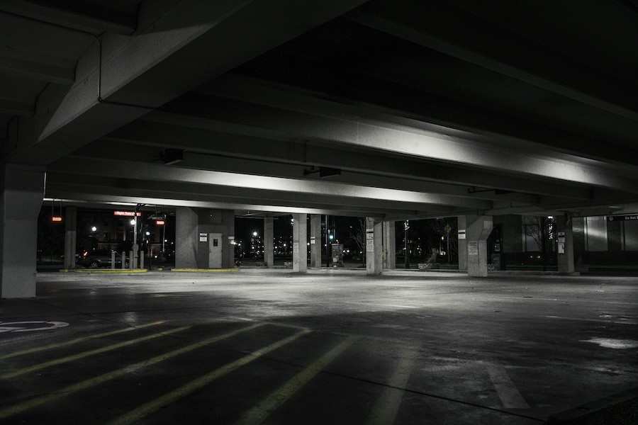 A dark empty parking lot.