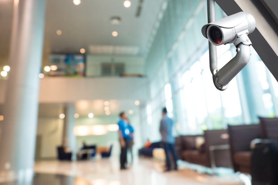 A security camera installed on a lobby wall. 