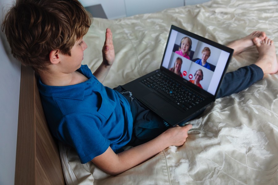 a kid having an online class on Zoom