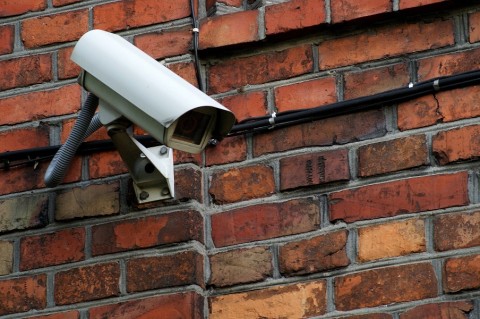 Security camera attached to a brick building