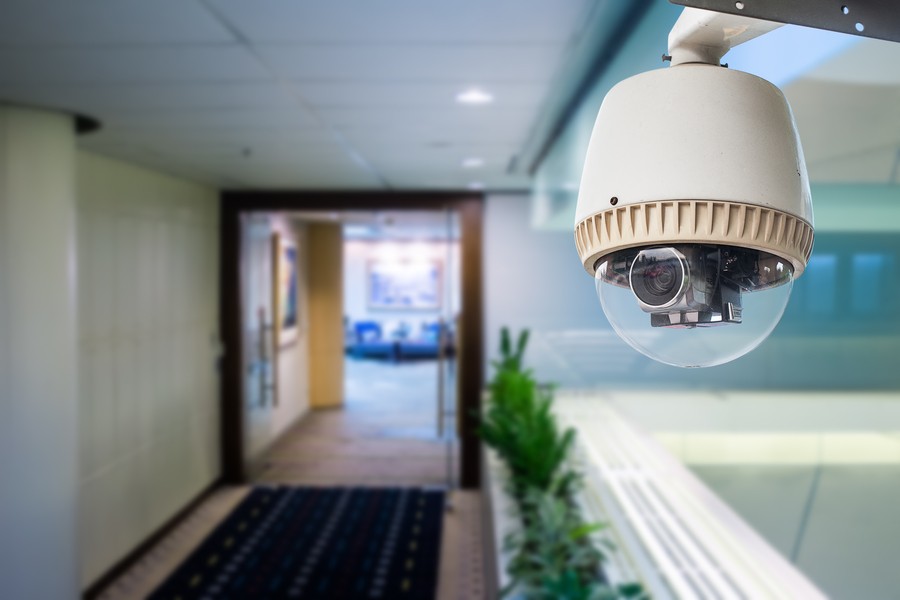 a security camera with motion detector alarm installed in a building