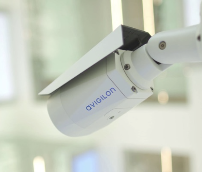 A ceiling-mounted Avigilon smart camera. 