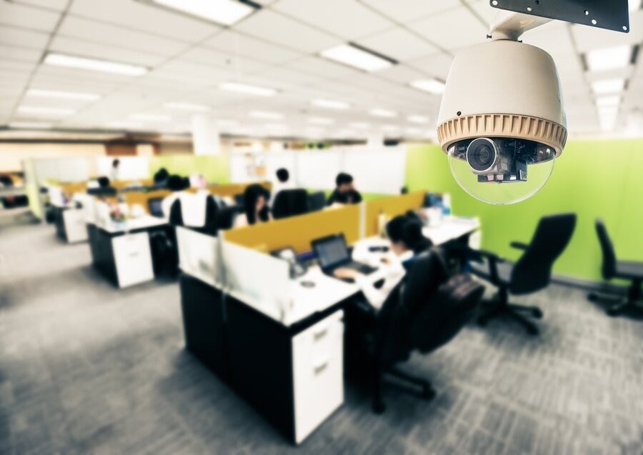 An office space featuring a security camera in focus.